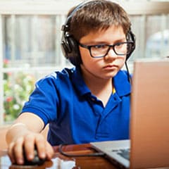 Child gaming on a laptop