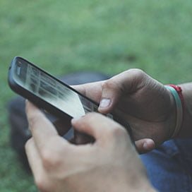 Young person texting on phone