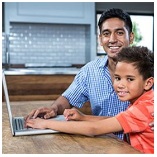 Parent and child using a laptop
