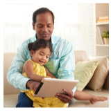 Parent and child looking at a tablet